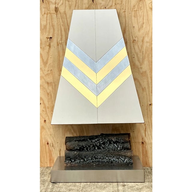 Vintage Boho Chevron Brass And Chrome Faux Fireplace brings sculptural warmth and graphic pattern to a room. Crafted from...