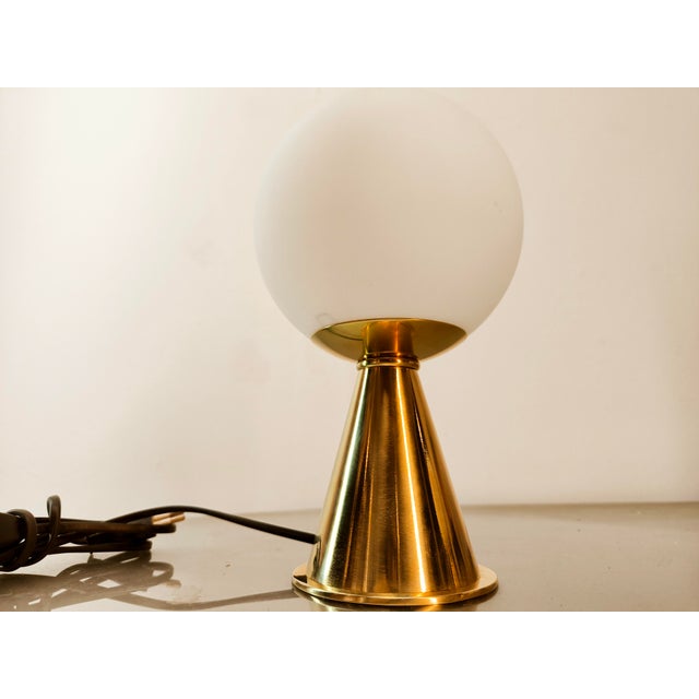 Brass Table Lamp with White Sphere, in Flawless conditions. Designed 1970 to 1979 European Plug (up to 250V).The wiring of...