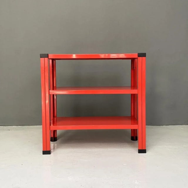 Italian modern red three-shelf metal bookcase, 1980s Metal bookcase with three shelves in red painted metal with black...