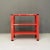 Italian modern red three-shelf metal bookcase, 1980s Metal bookcase with three shelves in red painted metal with black...