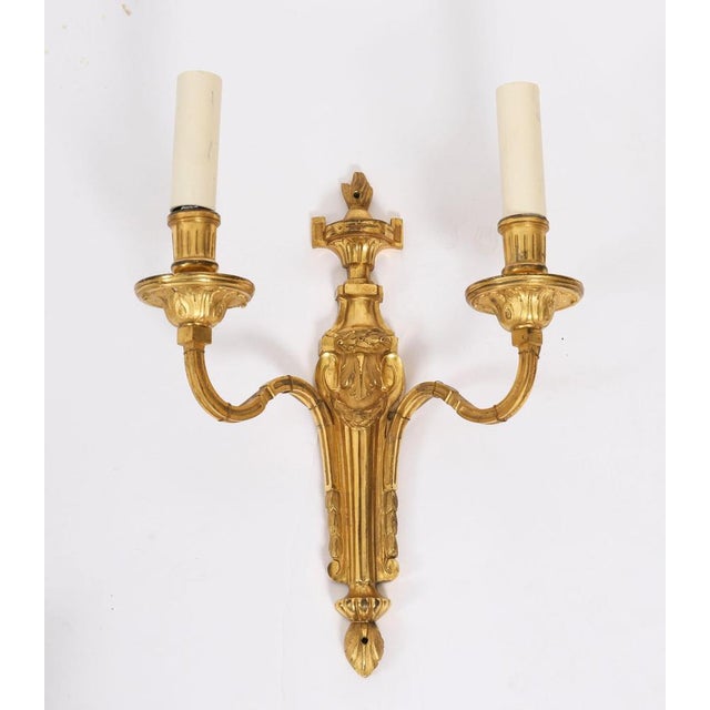 This is an elegant pair of antique French Louis Revival ormolu gilt wall-light sconces, C 1880 in date. Each wall light...