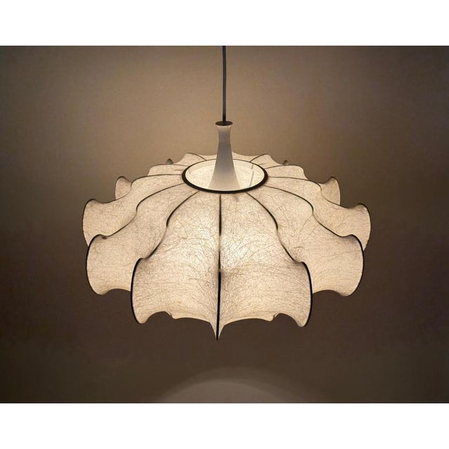 A true icon of Italian design, this Cocoon lamp, attributed to Achille & Pier Giacomo Castiglioni for Flos, is more than...