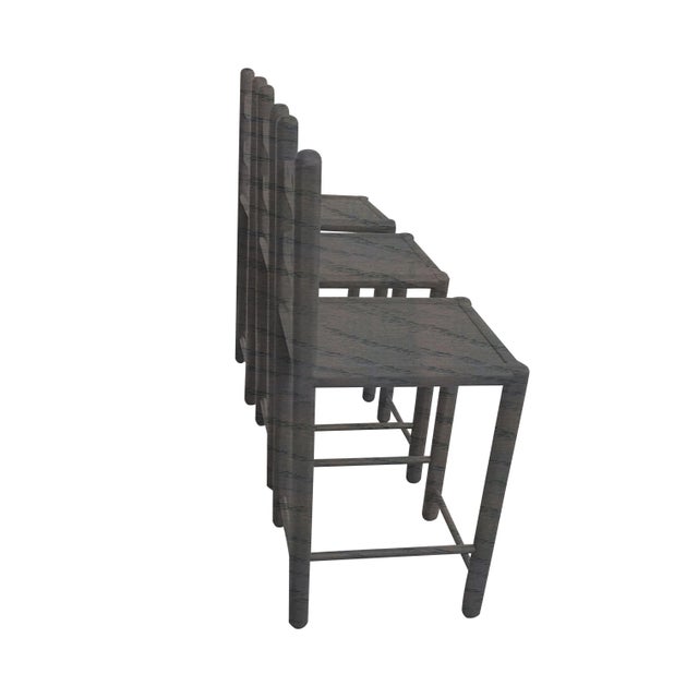 Set of 3mcountry French solid oak counter stools. Stools are done in a carbon gray finish. The stools were custom made....