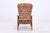 Vintage armchair with a teak frame. The clean lines of the frame meet a comfortably high backrest, providing a comfortable...