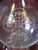 The product is an antique glass pitcher from the 1860s, hand-blown and featuring intricate Fleur de Lis engraving. This...