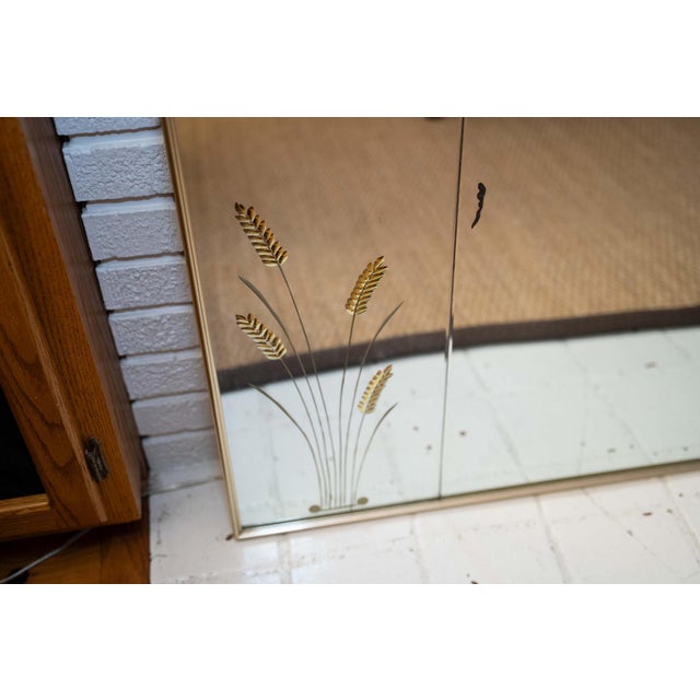 Here is a stunning, grand-scale Mid-Century Modern over-mantel mirror manufactured by the renowned Hart Mirror Plate...