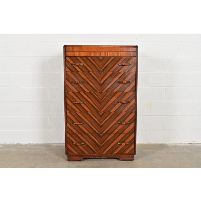 A beautiful Art Deco period five-drawer highboy dresser or chest of drawers In the manner of Donald Deskey USA, Circa...