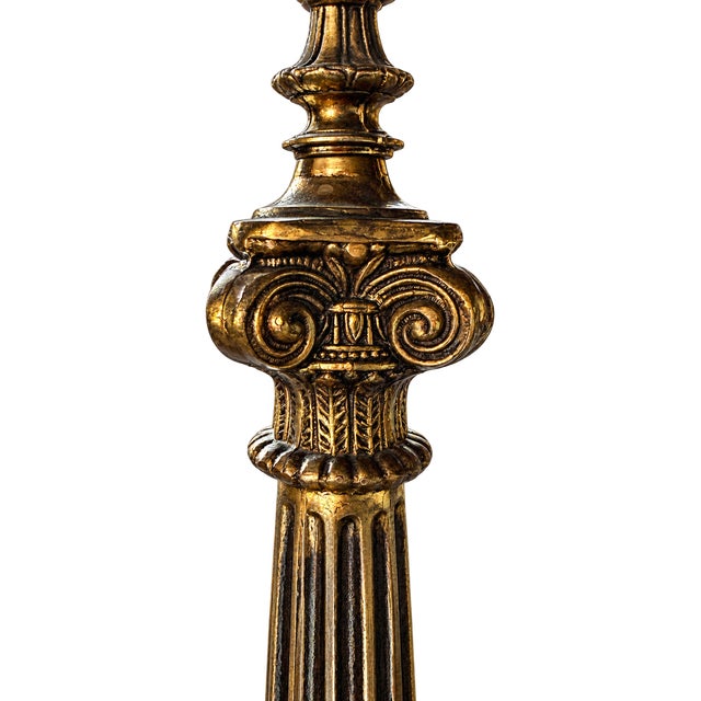Striking vintage Neoclassical table lamp featuring an exceptionally tall and architectural column form richly decorated...