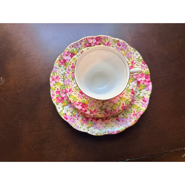 A gorgeous mid-century fine bone china tea trio set manufactured in England by Chapmans Longton Ltd under the prestigious...