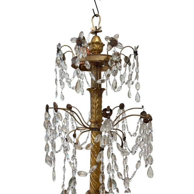 An impressive 18th century Genoese chandelier, handcrafted in Italy and showcasing the elegant artistry of the Genovese...