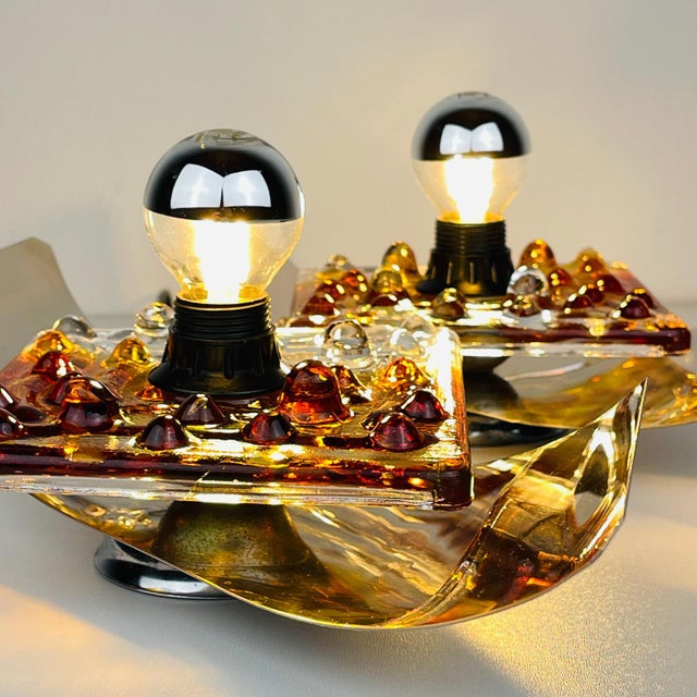 Beautiful pair of murano wall lamp by av mazzega made in italy in the 1970s. the lamp is in very good vintage condition,...