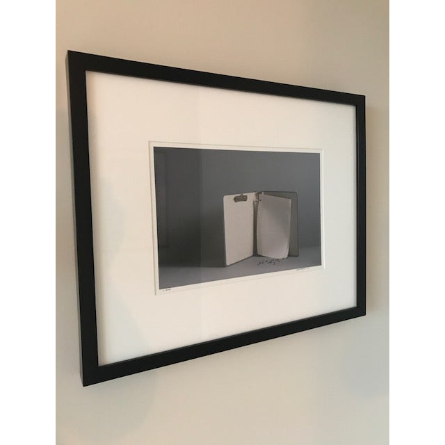 16" x 20" archival white matted print in black frame with glass. Image size approximately 8.5" x 12.5" The print is...