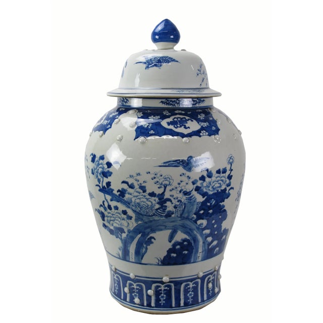 This gorgeous large blue and white porcelain jar is adorned with beautifully hand painted peonies, red plum and lovely...