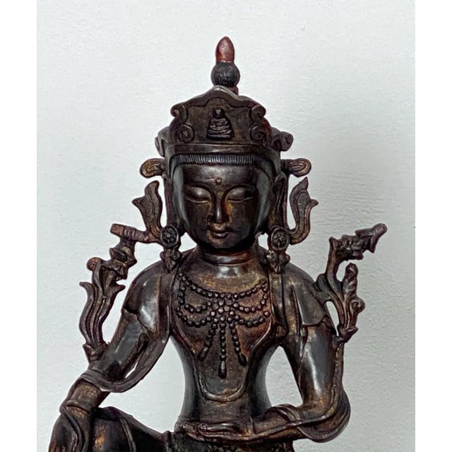 A very large Chinese casting of a Bodhisatva seated on a dragon, circa 1980.