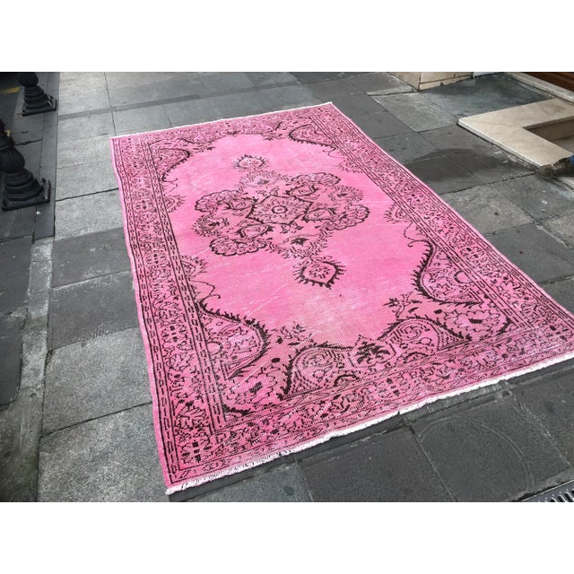 This is a vintage Turkish Oushak rug from the 1960s. The piece was hand-knotted.