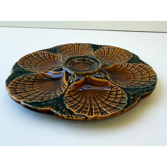 A striking vintage Majolica oyster plate by Sarreguemines, France, dating to circa 1950. This beautifully molded serving...