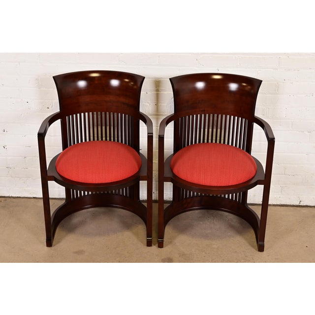 An exceptional pair of Arts & Crafts or Prairie style barrel chairs By Frank Lloyd Wright for Cassina Italy, 1989...