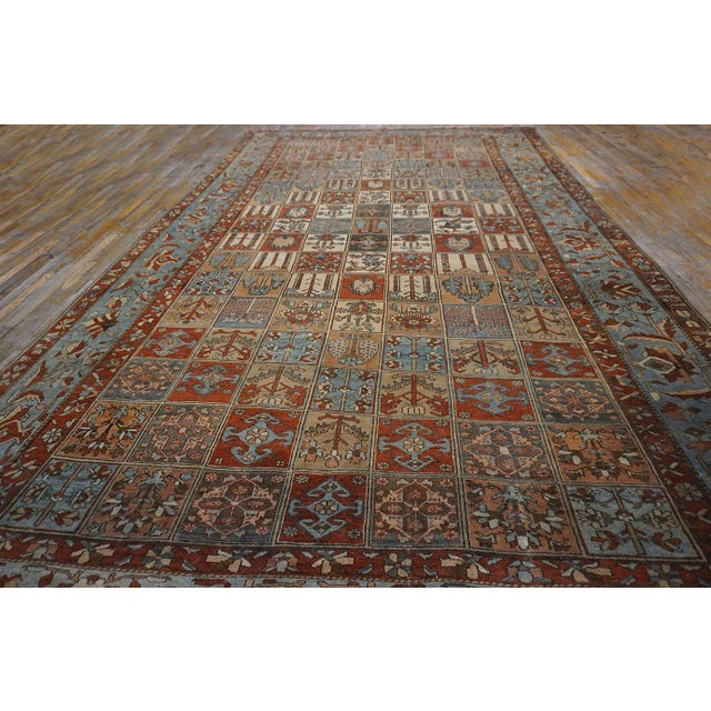 Antique Persian Bakhtiar Rug, Size: 10' 4" x17' 3" This early 20th century Persian Bakhtiari Garden carpet (10'4" × 17'3")...