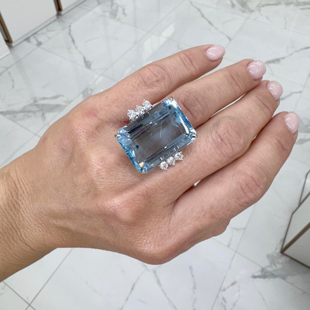 Gender: Ladies Metal Type: 18K White Gold Size: 5 Weight: 19.09 Grams 18K white gold six-across diamond and aquamarine...
