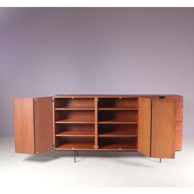1950s Japanese series cabinet CU08 by Cees Braakman, produced for Pastoe in the Netherlands, reflects Braakman’s...