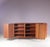1950s Japanese series cabinet CU08 by Cees Braakman, produced for Pastoe in the Netherlands, reflects Braakman’s...