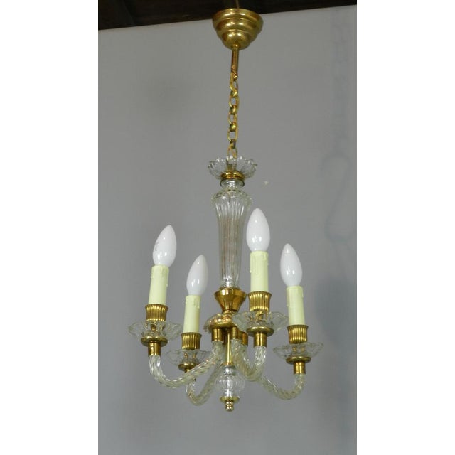 - A very pretty four light chandelier - Made of Murano glass with gold metal work - Central column leads down to four...