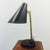 A table lamp designed by Paavo Tynell for Idman, Finland, circa 1950. Marked by manufacturer. Later painted shade and...