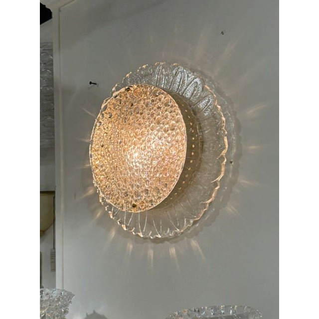 The Murano Gold and Clear Glass Sunburst Sconces are elegant lighting fixtures that add a touch of sophistication to any...