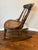 A delightful example of late Victorian craftsmanship, this petite antique rocking chair, circa 1880–1900, combines...