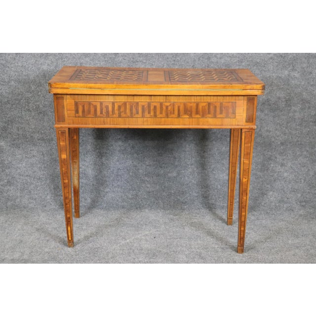 This exceptional 18th century Italian games table is a masterful example of neoclassical furniture craftsmanship, dating...