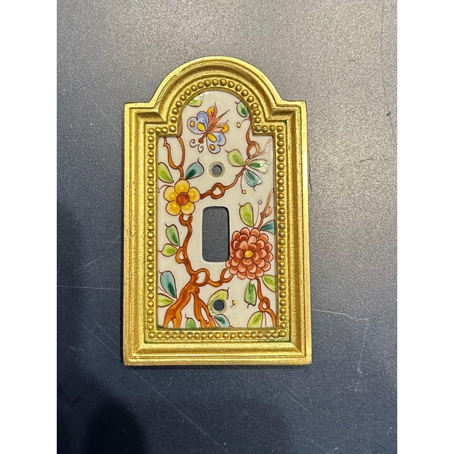 1 Sherle Wagner Summer Garden on White China Switch Plate. Burnished Gold Finish.