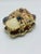 This charming vintage shell-encrusted trinket box captures the whimsical spirit of mid-century coastal décor. Crafted in a...
