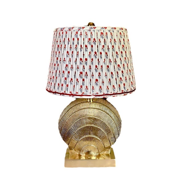 A stunning, vintage brass shell form lamp in the manner of Maison Charles. Features a solid, cast brass body in the form...