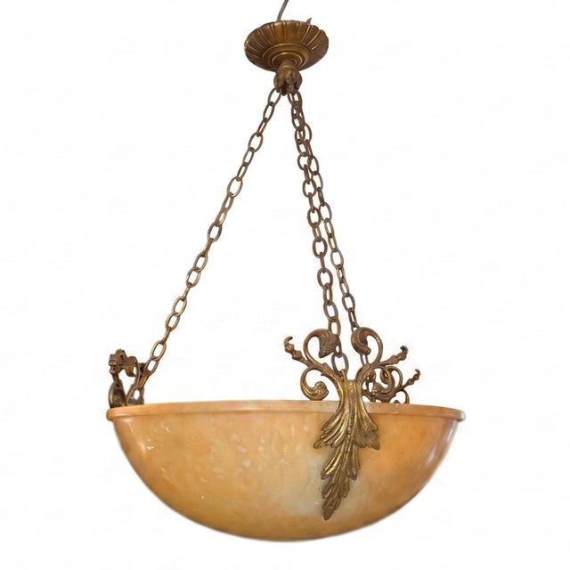 This decorative plafonnier was made in France in the early 1900s. A gorgeous amber colour alabaster shade is supported by...