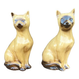 Mid 20th Century Ceramic Siamese Cats With Hand Painted Blue Eyes, Made in Brazil - a Pair For Sale