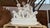 A charming and beautifully crafted solid Carrara marble sculpture depicting children joyfully playing, capturing a sense...