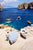 Capri Boats by Toni Frissell A Riva motorboat approaches a Capri dock with a yacht behind it and surrounded by various...
