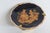 This lovely miniature plate is made of Porcelain and comes with a metal stand. This dainty porcelain collectible features...