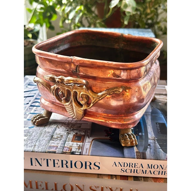 A beautifully handcrafted antique copper vessel dating to the Arts & Crafts and Art Nouveau period, featuring folded-lock...