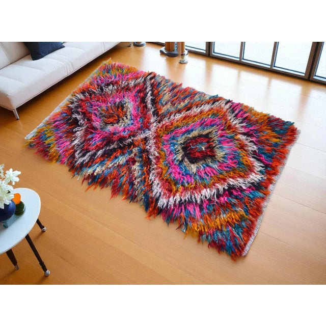 Step back in time with this exquisite semi-antique Turkish shag rug, masterfully hand-woven in the renowned rug-making...