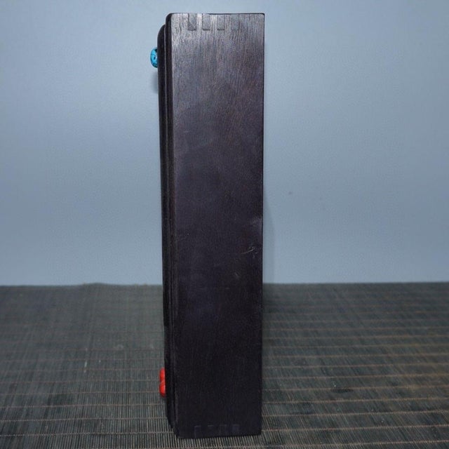 This beautifully crafted long box is a fine example of mixed-media artistry. Unlike standard hinged boxes, this piece...