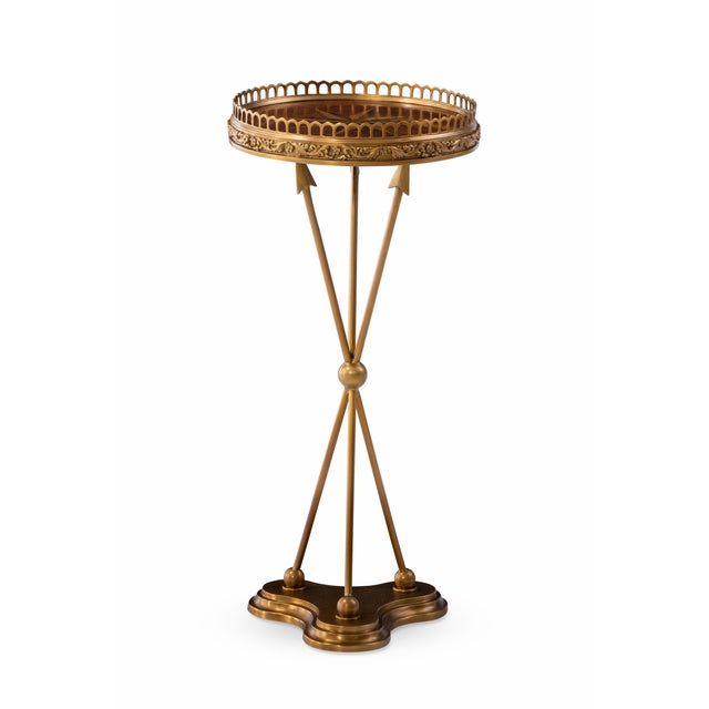 An exquisite example of classical artistry, this cast brass accent table is crowned with a marquetry inlaid top encircled...