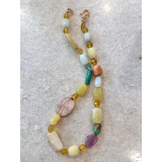 Lovely vintage mixed beaded necklace. A collection of Turquoise, yellow jade, amethyst, aqua marine, agate. Designed by...