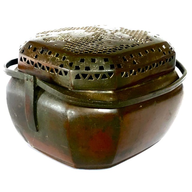 Filled with burning coals, this exquisitely crafted 19th-century brazier once warmed the cold hands of a wealthy woman on...