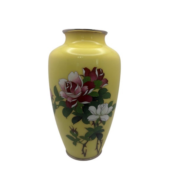 A vintage Japanese yellow cloisonné enamel vase by Ando Jubei, ca. 1930’s. The vase has a yellow enamel background with a...