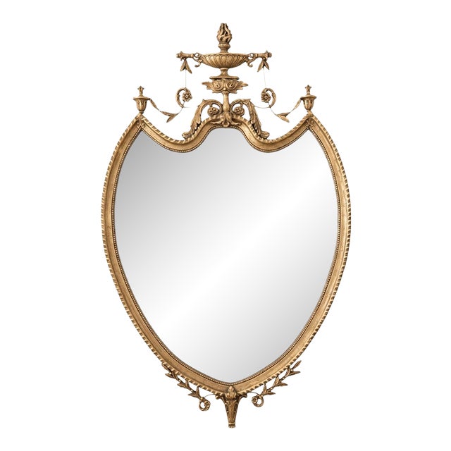 Giltwood Neoclassical Shield Wall Mirror With Urn Crest and Ornate Ribbon Swag For Sale