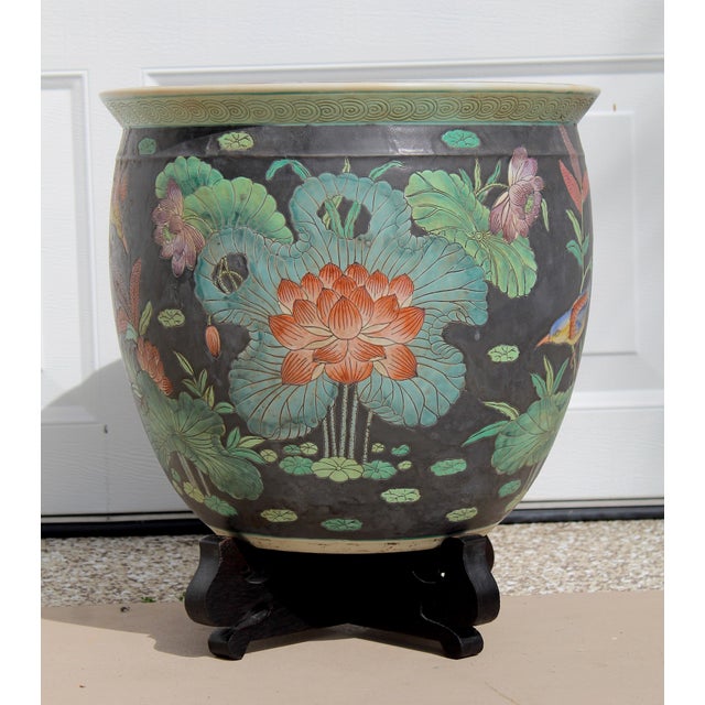 A magnificent large Chinese porcelain fishbowl jardinière or planter, beautifully decorated with colorful birds, lotus...