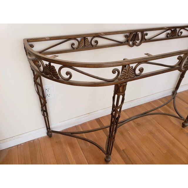 The Drexel Heritage Console Table Base embraces a Twisted Vine motif with Leaf details and elegant curves in a Bronze...