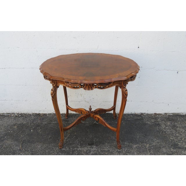 This elegant Center Table is made out of wood, solid wood, walnut, burlwood, and veneer. The Table has French style and...