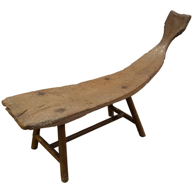 For the primitive collector. This stunning bench is hand carved from a single teak root from Madura. Beautiful antique...
